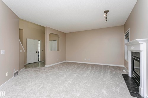 21 Alderson Close, Fort Saskatchewan, AB - Indoor Photo Showing Other Room With Fireplace