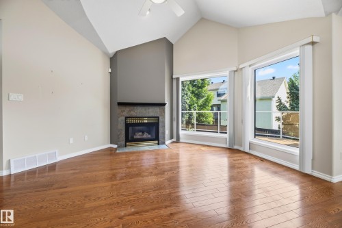 #4 11809 9B Av Nw, Edmonton, AB - Indoor Photo Showing Living Room With Fireplace