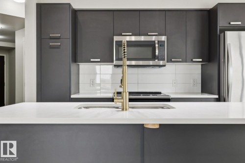 #904 10410 102 Av Nw, Edmonton, AB - Indoor Photo Showing Kitchen With Stainless Steel Kitchen With Upgraded Kitchen