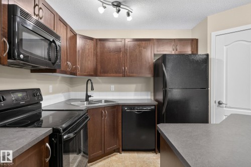 #210 392 Silver Berry Rd Nw, Edmonton, AB - Indoor Photo Showing Kitchen With Double Sink
