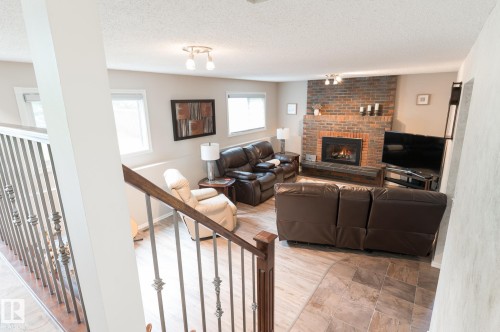94 Marlboro Drive, Spruce Grove, AB - Indoor Photo Showing Living Room With Fireplace