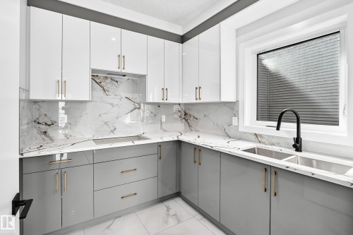 233 Crystal Creek, Leduc, AB - Indoor Photo Showing Kitchen With Double Sink