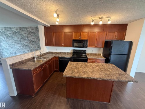 #8 3075 Trelle Cr Nw, Edmonton, AB - Indoor Photo Showing Kitchen With Double Sink