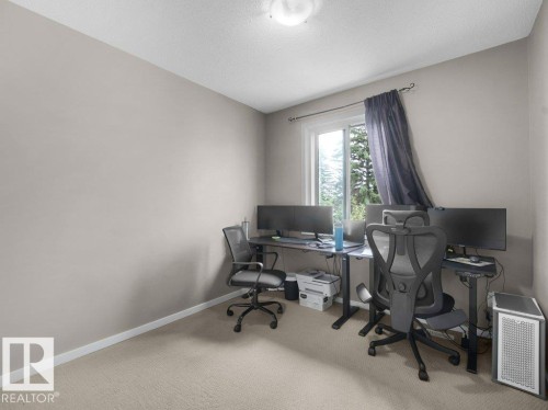 Neutral wall color, light-toned carpeting, and a window with natural light - 34 Amberly Court Nw, Edmonton, AB - Indoor Photo Showing Office