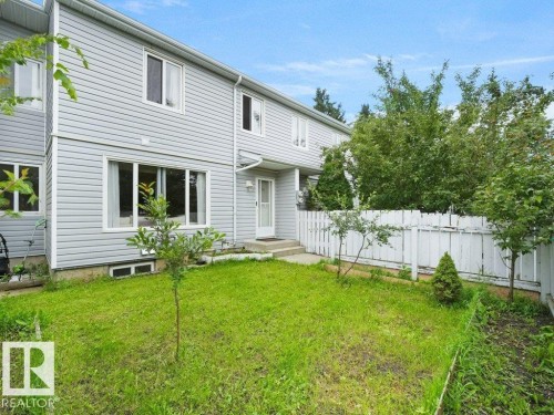Exterior with horizontal vinyl siding and white-framed windows - 34 Amberly Court Nw, Edmonton, AB - Outdoor