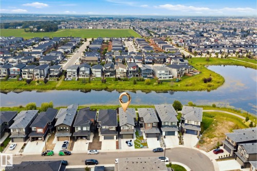 Aerial perspective of a developed residential area with waterside properties - 5493 Kootook Road Sw, Edmonton, AB - Outdoor With View