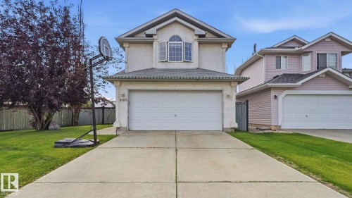 Two-story stucco home featuring a front-facing attached two-car garage - 4105 36A Avenue Nw, Edmonton, AB - Outdoor