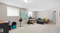 Spacious room with light neutral wall paint and white trim - 