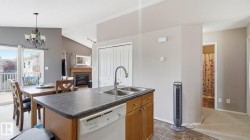 Kitchen island with integrated double basin sink and dishwasher - 