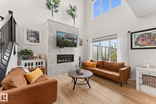 52 Avery Cove, Spruce Grove, AB - Indoor Photo Showing Living Room With Fireplace