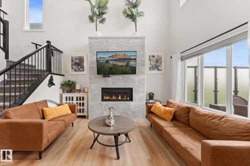 52 Avery Cove, Spruce Grove, AB - Indoor Photo Showing Living Room With Fireplace
