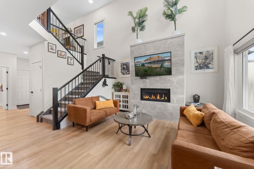 52 Avery Cove, Spruce Grove, AB - Indoor Photo Showing Other Room With Fireplace