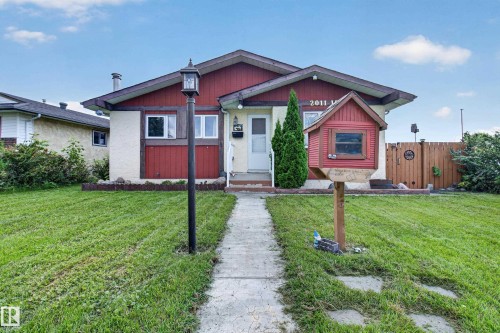 Exterior featuring a gabled roof, mixed siding, and a concrete pathway - 2011 151 Avenue Nw, Edmonton, AB - Outdoor