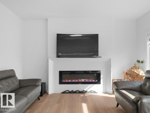 1077 Cristall Crescent Sw, Edmonton, AB - Indoor Photo Showing Living Room With Fireplace