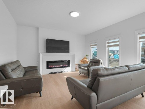 1077 Cristall Crescent Sw, Edmonton, AB - Indoor Photo Showing Living Room With Fireplace