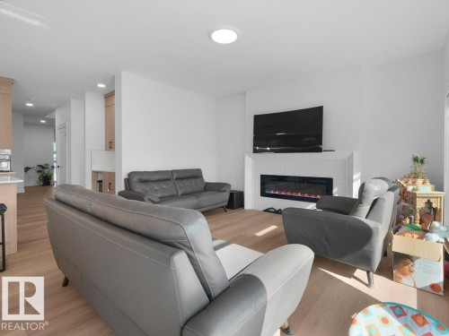 1077 Cristall Crescent Sw, Edmonton, AB - Indoor Photo Showing Living Room With Fireplace