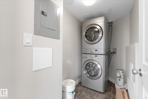 Insuite laundry with some storage - #505 10346 117 St Nw, Edmonton, AB - Indoor Photo Showing Laundry Room