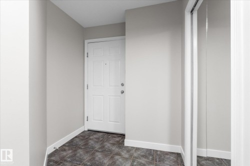 Unit door entry with closet space - #505 10346 117 St Nw, Edmonton, AB - Indoor Photo Showing Other Room
