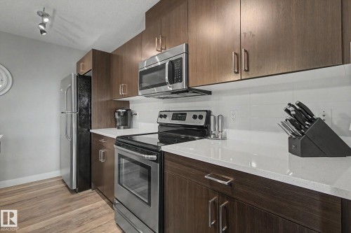 7147 Cardinal Way Sw, Edmonton, AB - Indoor Photo Showing Kitchen With Stainless Steel Kitchen