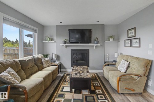 7147 Cardinal Way Sw, Edmonton, AB - Indoor Photo Showing Living Room With Fireplace