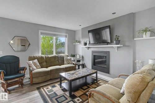 7147 Cardinal Way Sw, Edmonton, AB - Indoor Photo Showing Living Room With Fireplace
