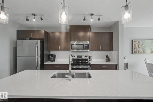 7147 Cardinal Way Sw, Edmonton, AB - Indoor Photo Showing Kitchen With Stainless Steel Kitchen With Double Sink With Upgraded Kitchen