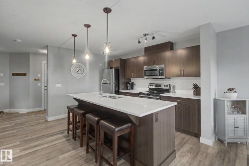 7147 Cardinal Way Sw, Edmonton, AB - Indoor Photo Showing Kitchen With Stainless Steel Kitchen With Double Sink With Upgraded Kitchen