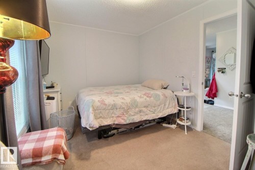 Soft neutral carpeting, light-colored walls, and blinds on a window - 417 Oak Wood Crescent Northwest, Edmonton, AB - Indoor Photo Showing Bedroom