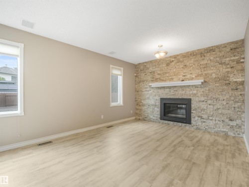 4335 47 Street Nw, Edmonton, AB - Indoor Photo Showing Living Room With Fireplace