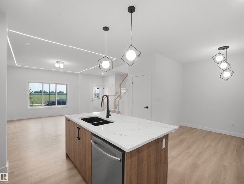 Beaumont, AB - Indoor Photo Showing Kitchen With Double Sink