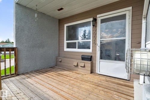 Wood-finish decking, horizontal siding, and a security screen door - 17775 95 Street Nw, Edmonton, AB 