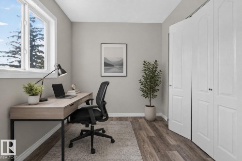Wood-finish flooring, light grey wall paint, and white trim - 17775 95 Street Nw, Edmonton, AB 