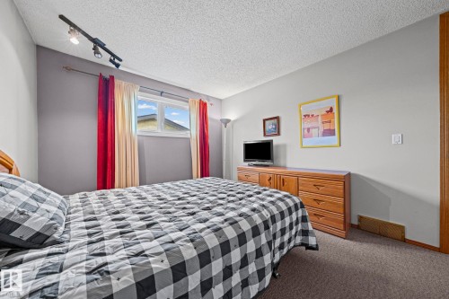 Recessed window with white frame and track lighting fixture - 17908 92A Street Nw, Edmonton, AB - Indoor Photo Showing Bedroom