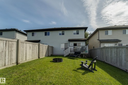 Manicured lawn, wood privacy fencing, and an elevated wood deck - 6218 1A Avenue Sw, Edmonton, AB - Outdoor With Deck Patio Veranda