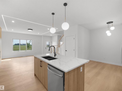 Beaumont, AB - Indoor Photo Showing Kitchen With Double Sink