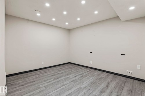Recessed lighting, wood-finish flooring, and white walls - 5210 23 Ave Sw, Edmonton, AB - Indoor Photo Showing Other Room