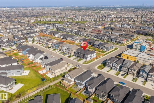 Residential neighborhood with detached homes, integrated garages, and fenced backyards - 5210 23 Ave Sw, Edmonton, AB - Outdoor With View