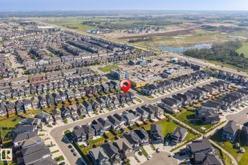 Residential development with multiple housing units, commercial buildings, and roadways - 5210 23 Ave Sw, Edmonton, AB - Outdoor With View