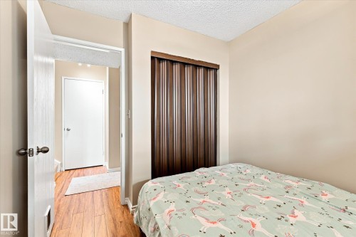 Wood-finish flooring throughout - 6471 180 Street Nw, Edmonton, AB - Indoor Photo Showing Bedroom