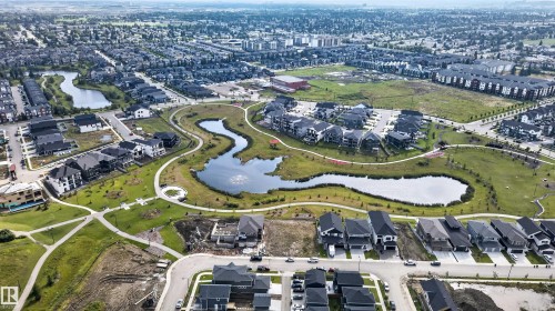 Expansive residential area featuring numerous single-family homes, multi-story residential buildings, and open green spaces - 4471 Mccrae Avenue Nw, Edmonton, AB -  With View