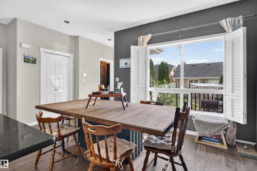 Hardwood-finish flooring, built-in window shutters, and recessed ceiling lighting - 4471 Mccrae Avenue Nw, Edmonton, AB - Indoor Photo Showing Dining Room