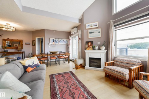 #307 9927 79 Av Nw, Edmonton, AB - Indoor Photo Showing Living Room With Fireplace