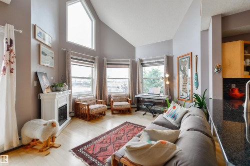 #307 9927 79 Av Nw, Edmonton, AB - Indoor Photo Showing Living Room With Fireplace