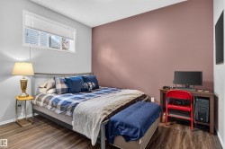 Wood-finish flooring, two-tone painted walls, and a window with blinds - 