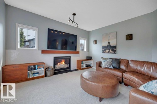 6483 Sandin Crescent Nw, Edmonton, AB - Indoor Photo Showing Living Room With Fireplace