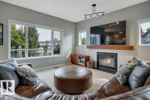6483 Sandin Crescent Nw, Edmonton, AB - Indoor Photo Showing Living Room With Fireplace