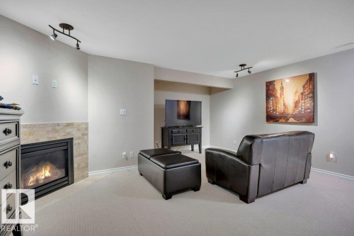 6483 Sandin Crescent Nw, Edmonton, AB - Indoor Photo Showing Other Room With Fireplace