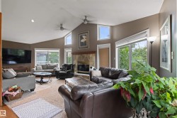 Vaulted ceiling with recessed lighting and ceiling fans - 