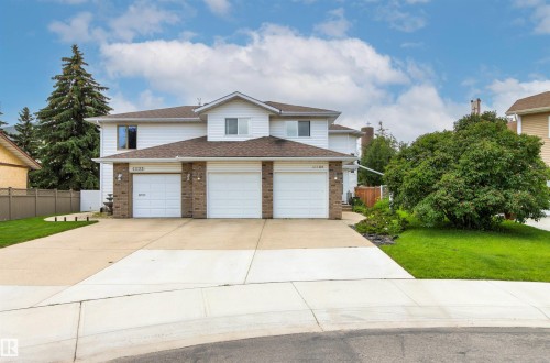 Two-story exterior with white siding and brick accents - 11139 157 Avenue Nw, Edmonton, AB - Outdoor With Facade