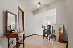 Wood-finish flooring with a wood railing and trim accents - 